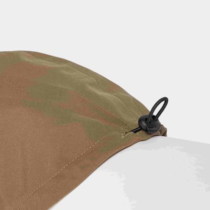 Close up of the rubber band size adjustment of the dog raincoat in sienna color