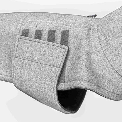 Velcro closure of a grey wintercoat for dogs with under belly protection