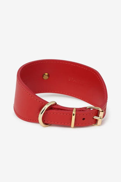 Back side of the wide red leather dog collar with gold hardware