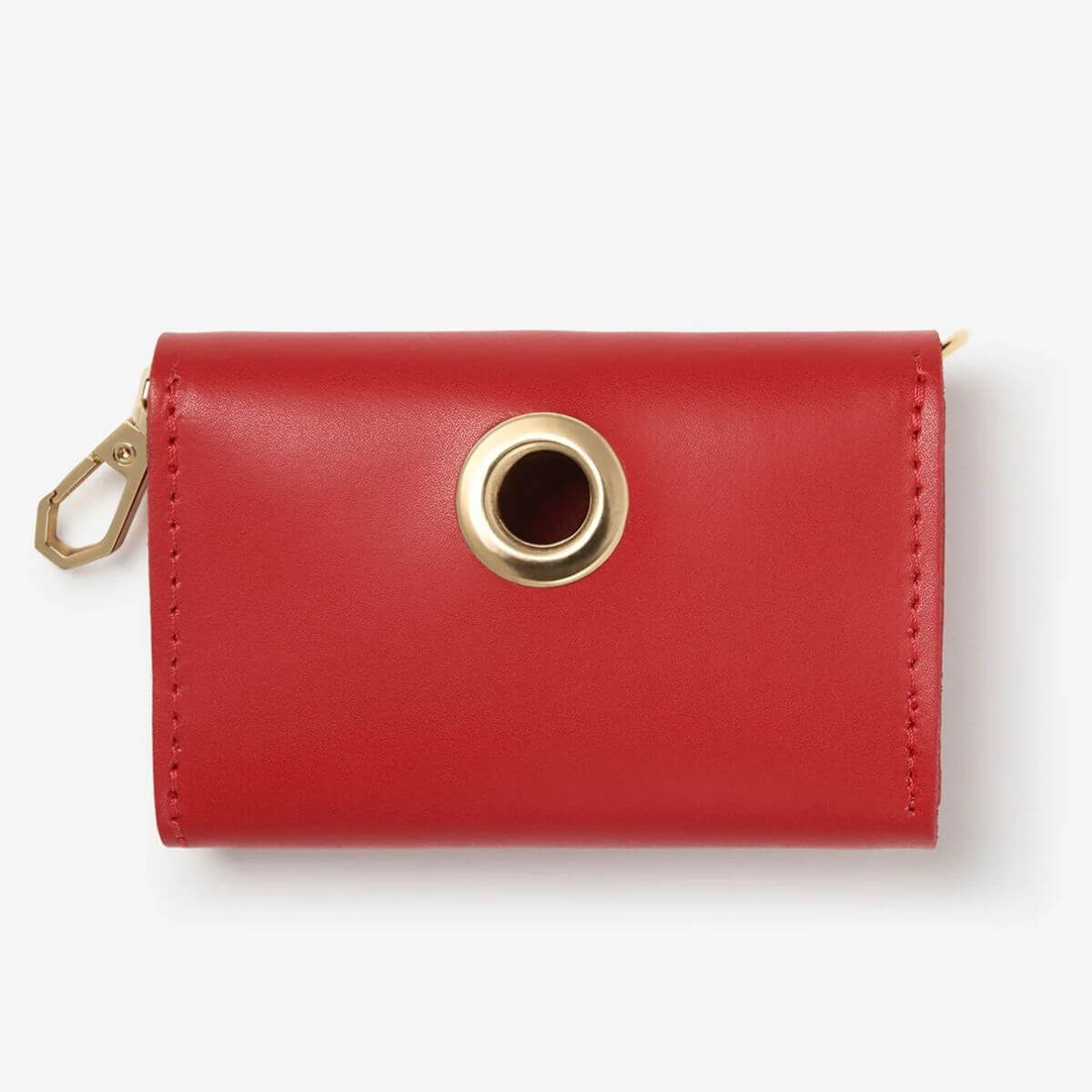 Front view of red Branni Pets poop bag holder with central gold ring and zipper on the side. Vorderansicht des roten Kotbeutelhalters von Branni Pets mit goldenem Ring in der Mitte und seitlichem Reißverschluss. Vue de face du distributeur de sacs rouges Branni Pets avec anneau doré central et fermeture éclair latérale.